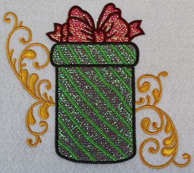 Embroidery Design: Christmas present with swirls<br> 6.68w X 5.96h