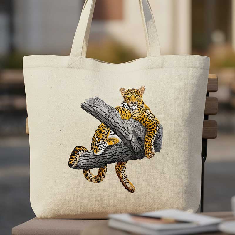 Leopard in tree tote bag