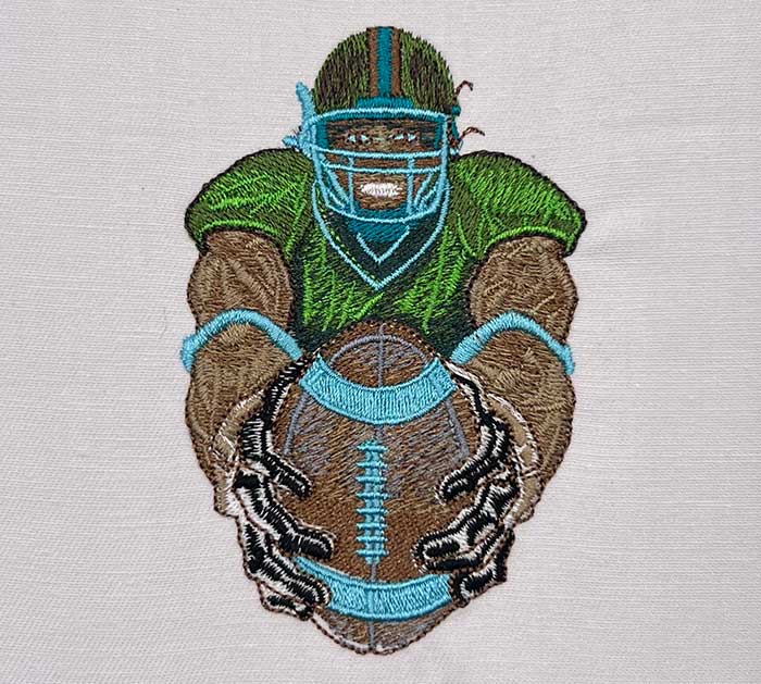 football player holding ball embroidery design