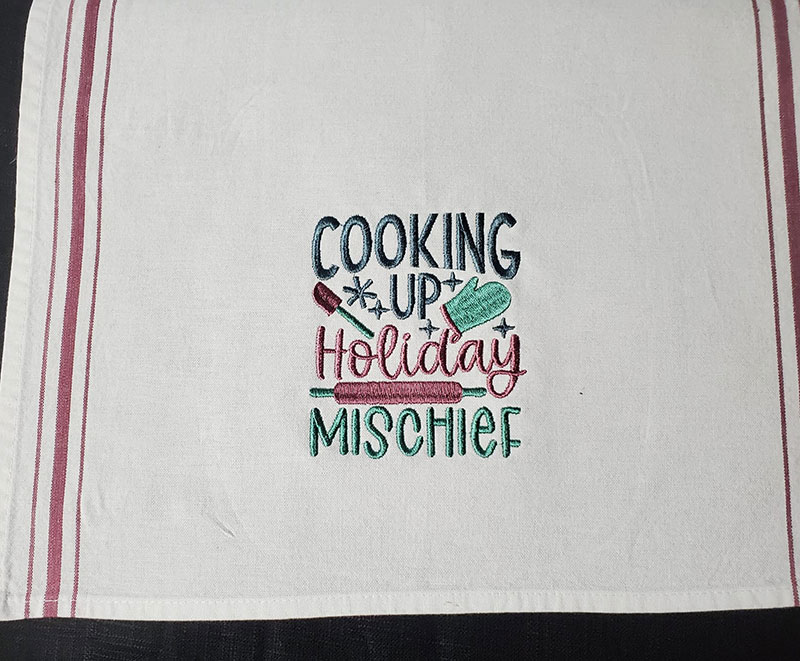 DebbieJ-CookingUpHolidayMichief | Embroidery Legacy cooking up holiday mischief towel