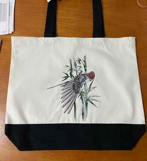 Okinawa bird with bamboo bag