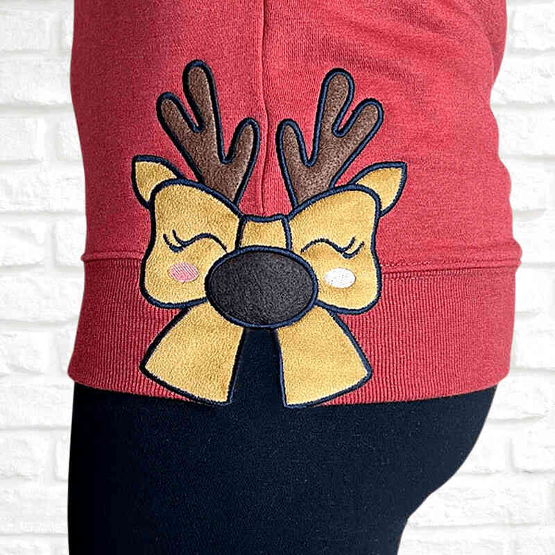 Sweater reindeer bow side seam applique embroidery design