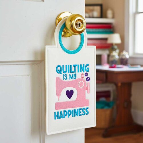 Quilting is happiness door hanger