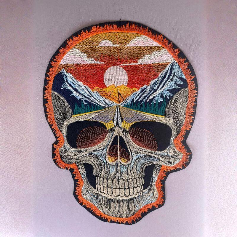 Skull with mountains embroidery design stitch out