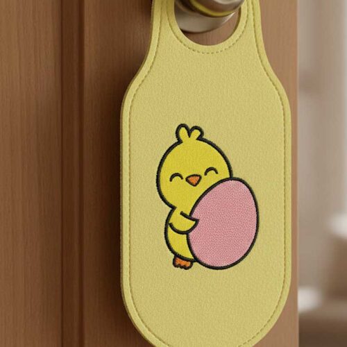 chick holding egg door hanger