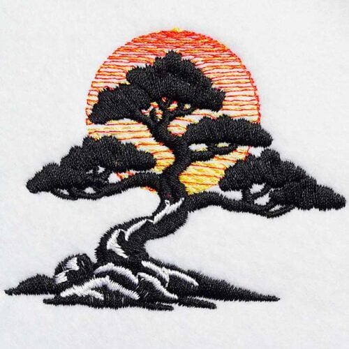 Embroidered silhouette of a windswept pine tree on rocks with a red-orange sun setting behind.