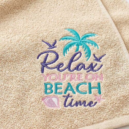 Beige towel with teal embroidered palm tree and the pastel pink/teal phrase 'Relax You're on Beach Time'.