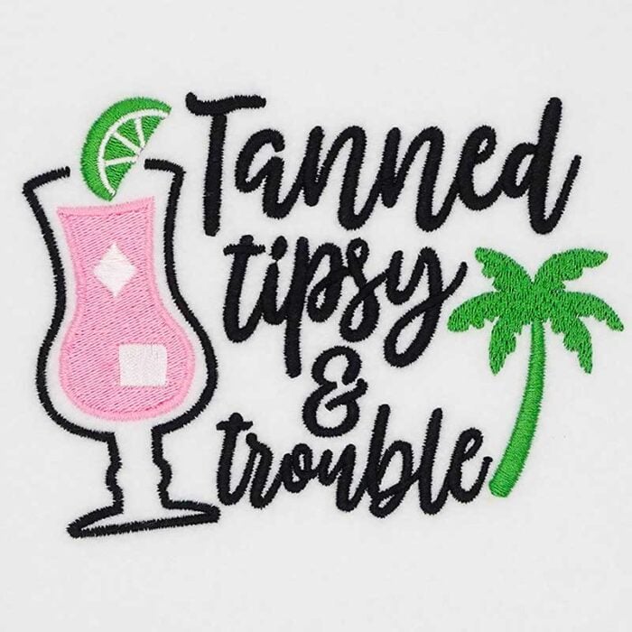 SDSB_TannedTipsy | Embroidery Legacy Embroidered design reading 'Tanned tipsy & trouble' with a pink cocktail glass, lime wedge, and a green palm tree