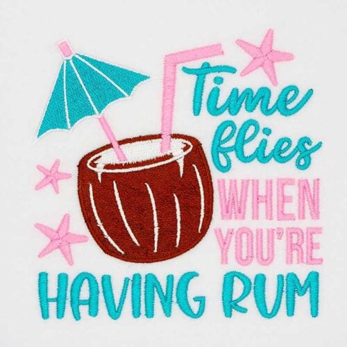 Embroidered coconut drink with an umbrella and pink straw, with the caption 'Time flies when you're having rum' in teal and pink.