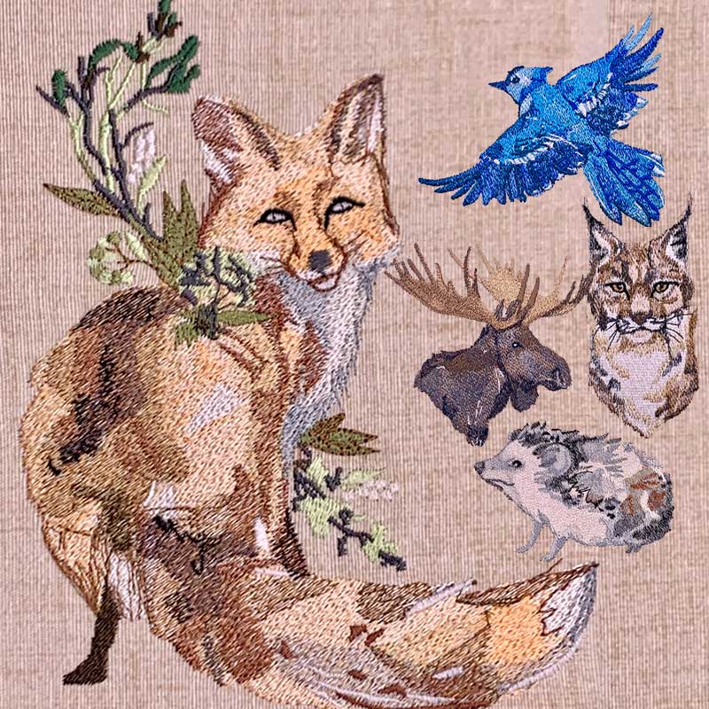 Embroidery tapestry showing a fox with a green leafy sprig, a blue bird in flight, a moose head, an owl, and a small hedgehog-like creature.