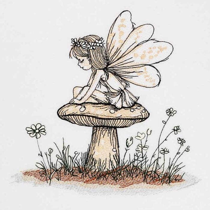 EL-FairyToadstool | Embroidery Legacy Fairy with wings sitting on a mushroom in a small meadow with flowers beside her.