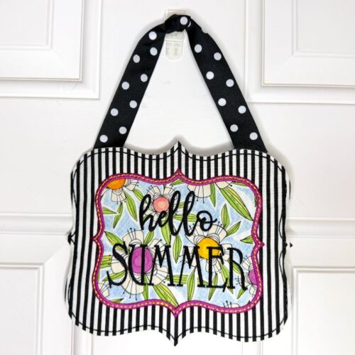 Decorative tote bag with black-and-white stripes, colorful floral panel, and a pink-edged label reading 'hello summer' on a polka-dot strap
