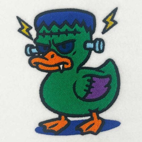 EL_HD_Frankenduck | Embroidery Legacy Embroidery patch of a grumpy green duck with blue hair, orange beak, purple wing, and yellow lightning bolts at the sides.